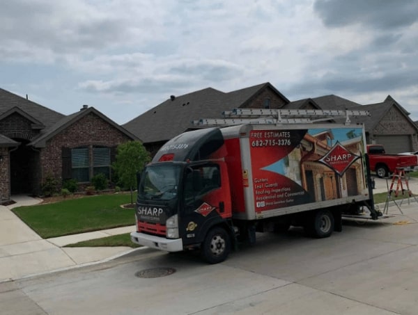 Parked Gutter Maintenance Fort Worth TX truck from Seamless gutters